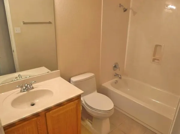 a bathroom with a sink a toilet and bathtub