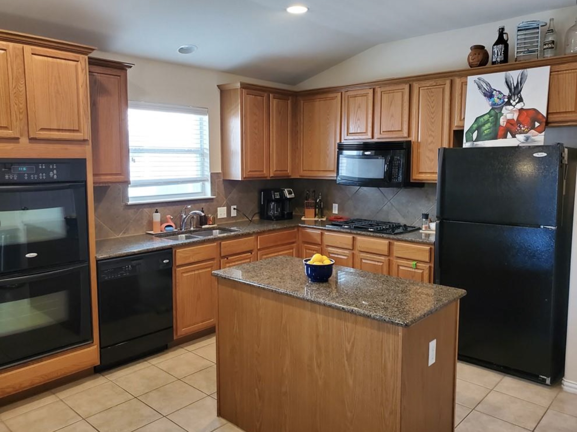 2344 Chimney Rock Road Leander, TX 78641 - Photo 2 of 14 a kitchen with stainless steel appliances granite countertop a sink stove and refrigerator