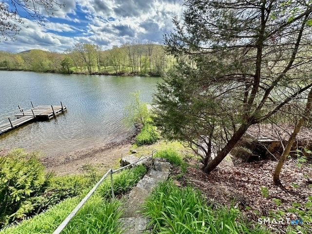 11 Bogus Hill Road New Fairfield, CT 06812 - Photo 4 of 15 a view of a lake with houses