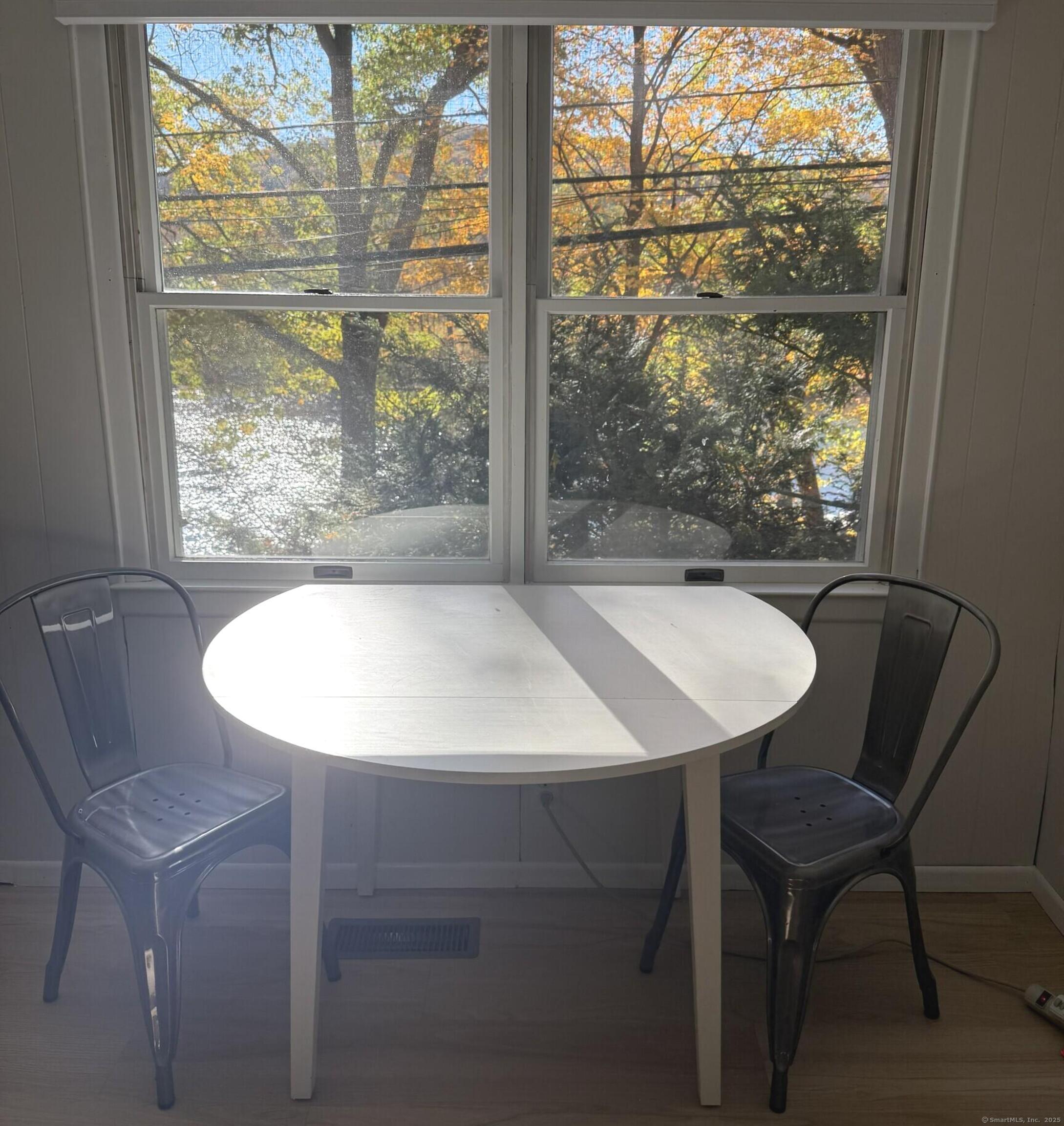 11 Bogus Hill Road New Fairfield, CT 06812 - Photo 6 of 15 a view of a dining room with furniture window and outside view