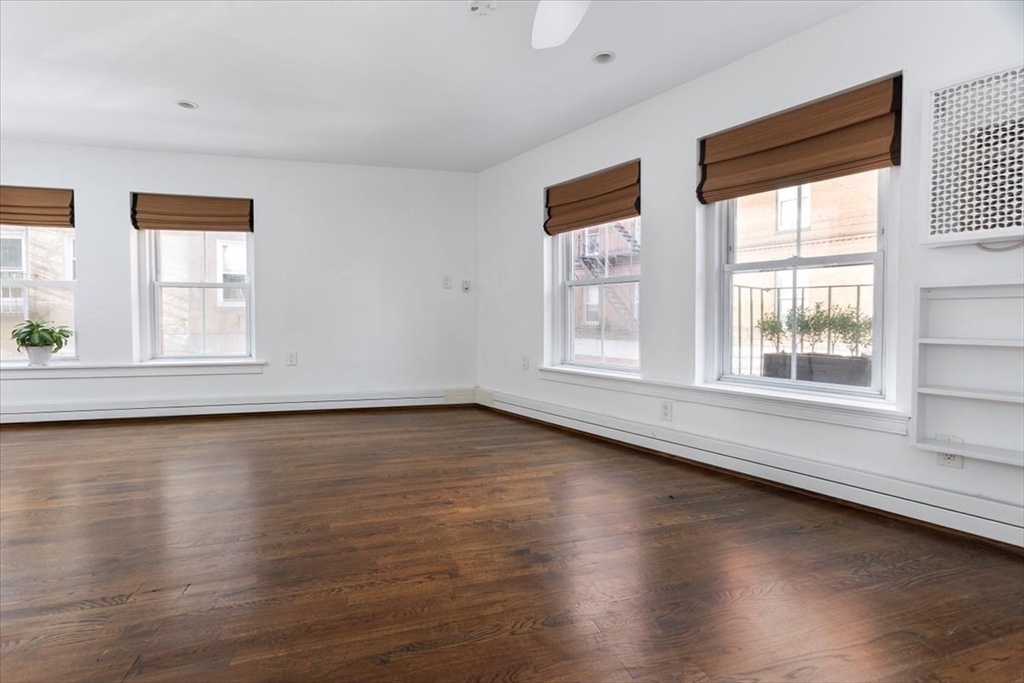 21 Moon Street, Unit 2 Boston, MA 02113 - Photo 13 of 19 a view of an empty room with wooden floor and a window