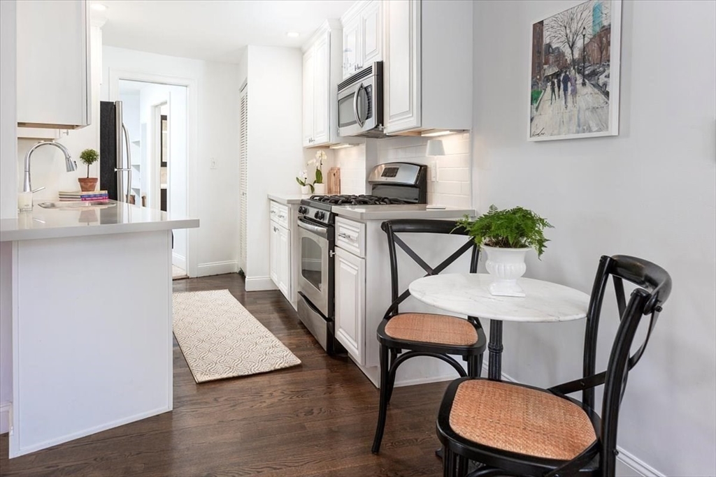21 Moon Street, Unit 2 Boston, MA 02113 - Photo 4 of 19 a view of a dining room with furniture and a potted plant