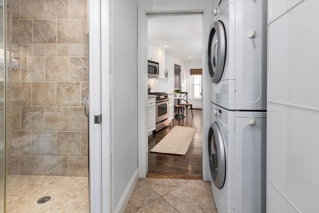 21 Moon Street, Unit 2 Boston, MA 02113 - Photo 8 of 19 a view of a hallway with a washer and dryer
