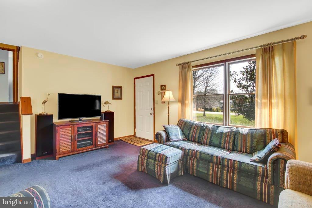 1447 Oldfield Point Road Elkton, MD 21921 - Photo 3 of 30 Living Room With Lots Of Natural Light