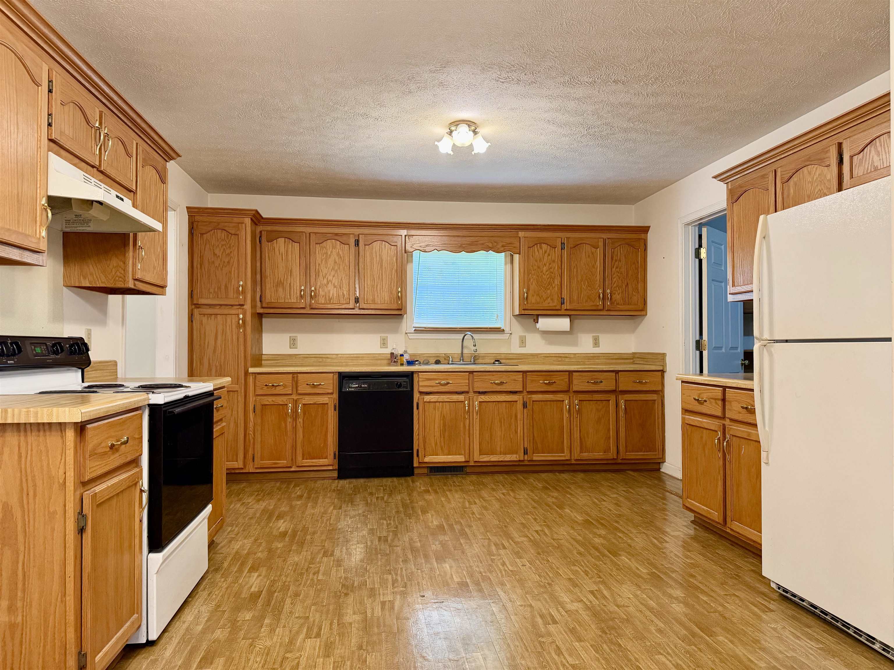 3010 Powell Chapel Road Middleton, TN 38052 - Photo 5 of 28 a kitchen with stainless steel appliances and wooden cabinets