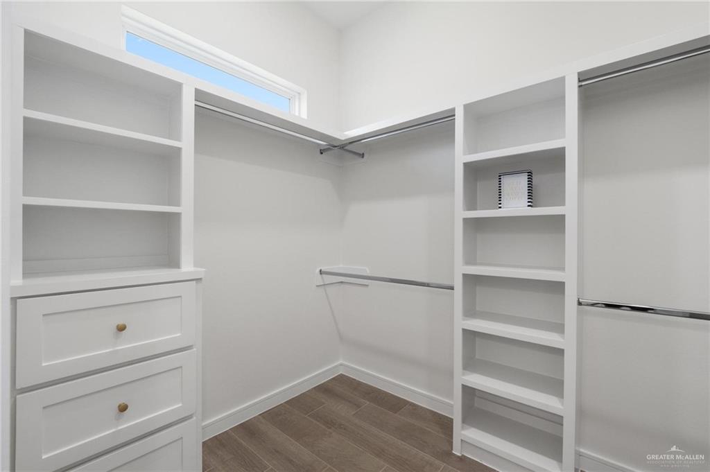 505 Freedom Way Weslaco, TX 78596 - Photo 16 of 20 a view of walk in closet with empty racks