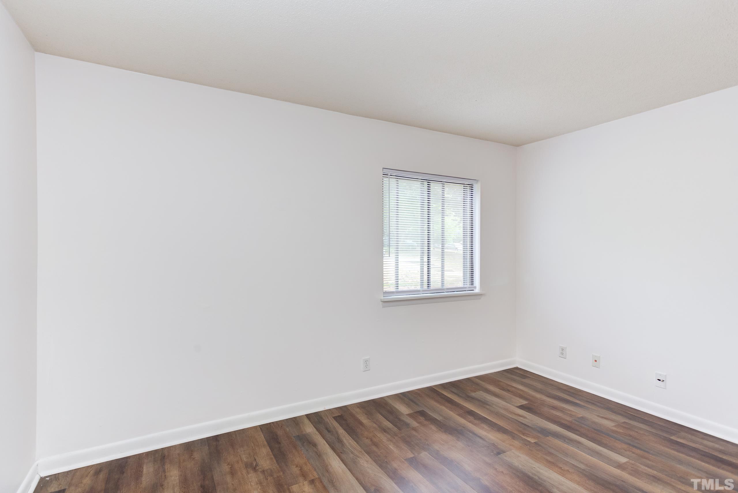 5060 Flint Ridge Place, Unit 5060 Raleigh, NC 27609 - Photo 13 of 29 an empty room with a window