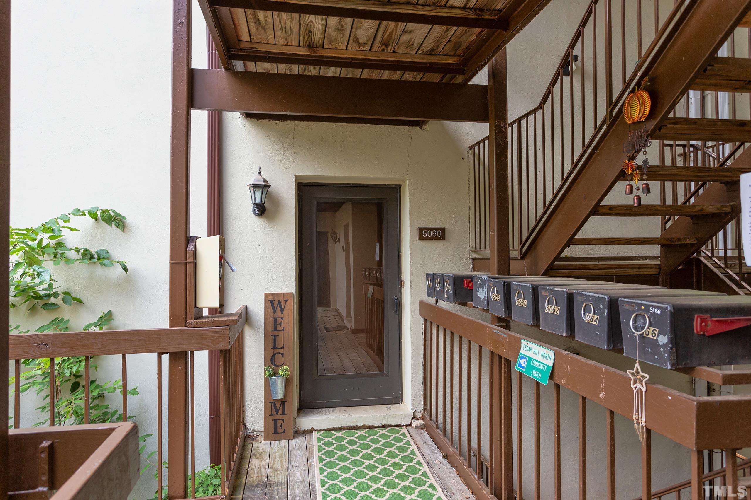 5060 Flint Ridge Place, Unit 5060 Raleigh, NC 27609 - Photo 2 of 29 a view of an entryway with staircase