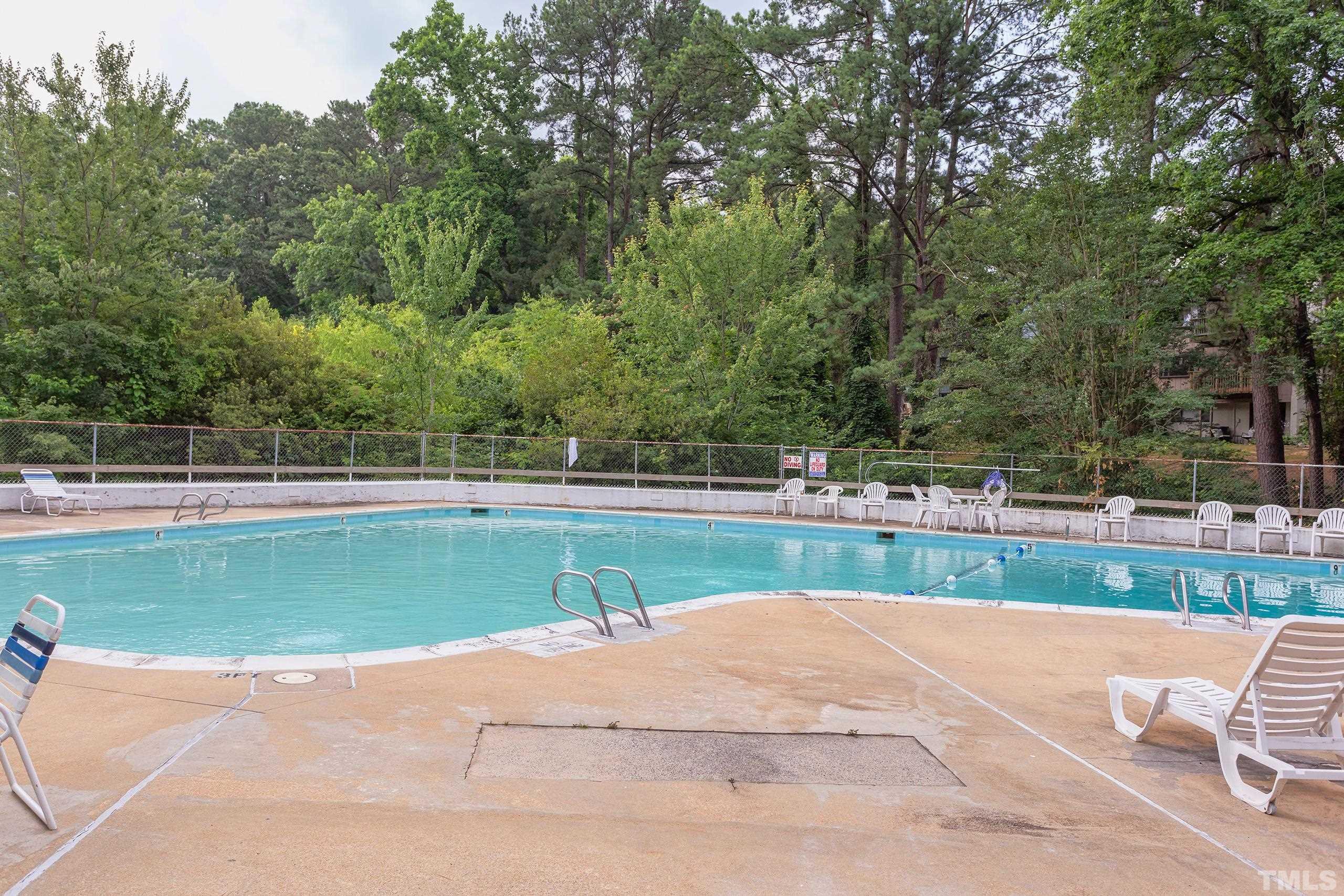 5060 Flint Ridge Place, Unit 5060 Raleigh, NC 27609 - Photo 28 of 29 a view of a tennis court