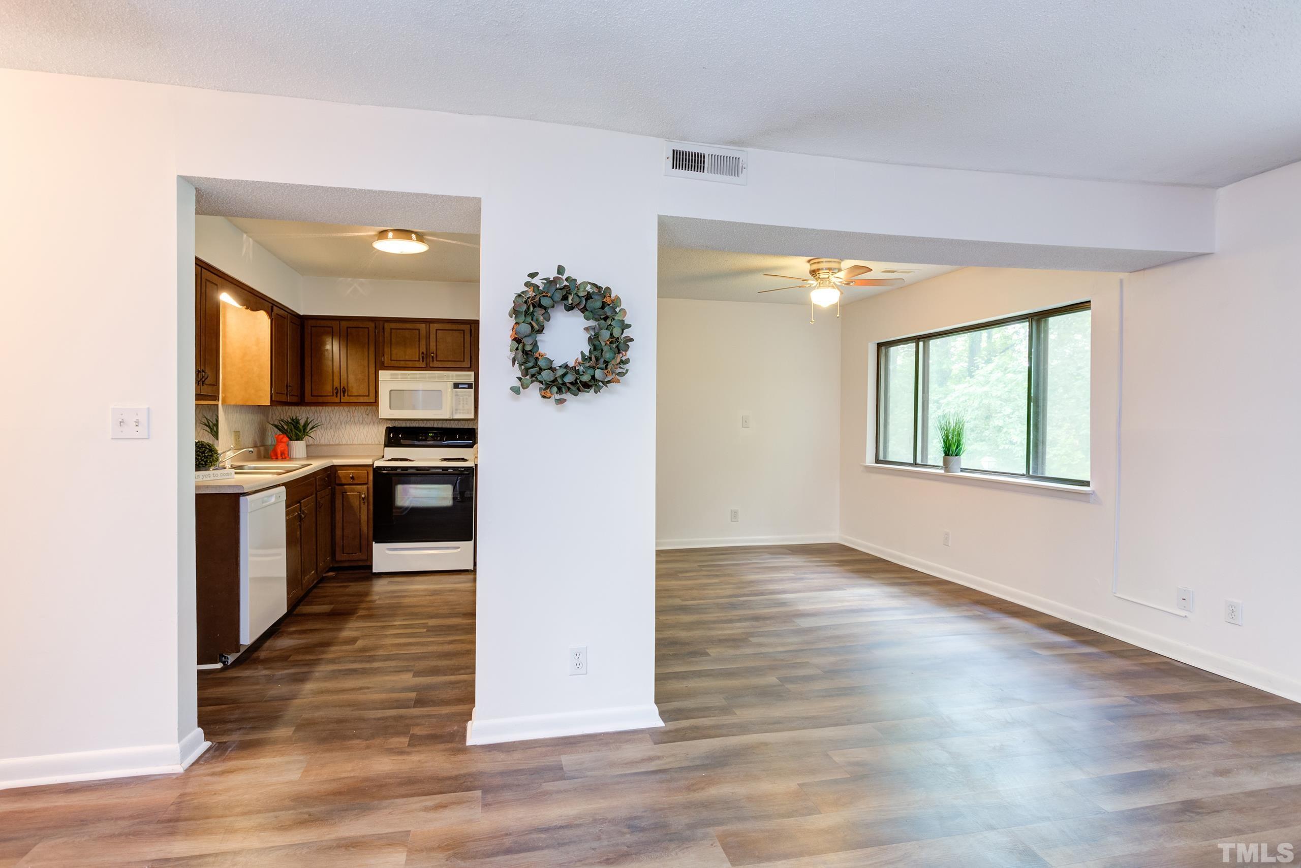 5060 Flint Ridge Place, Unit 5060 Raleigh, NC 27609 - Photo 9 of 29 a view of kitchen with cabinets and wooden floor