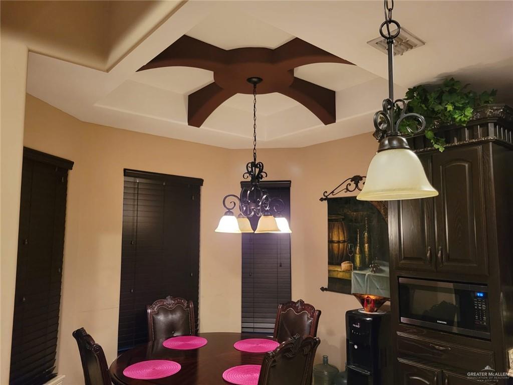 5996 Yarrow Drive Rio Grande City, TX 78582 - Photo 16 of 25 a dining room with furniture and chandelier