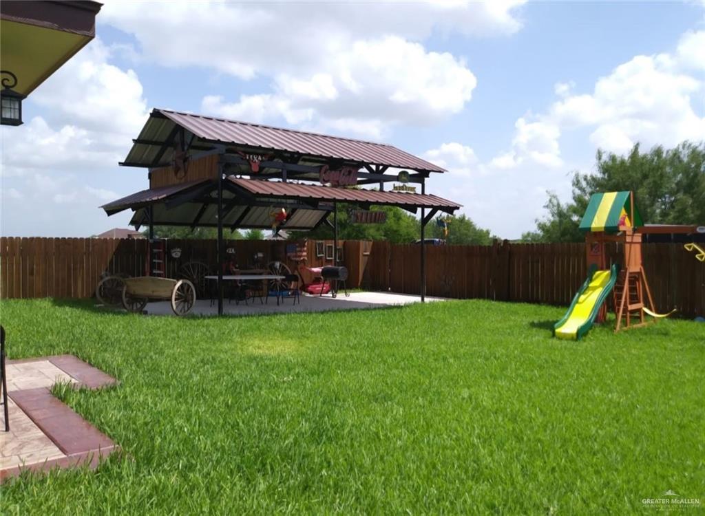 5996 Yarrow Drive Rio Grande City, TX 78582 - Photo 9 of 25 a view of a house with backyard and a slide