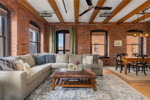 a living room with furniture wooden floor and furniture