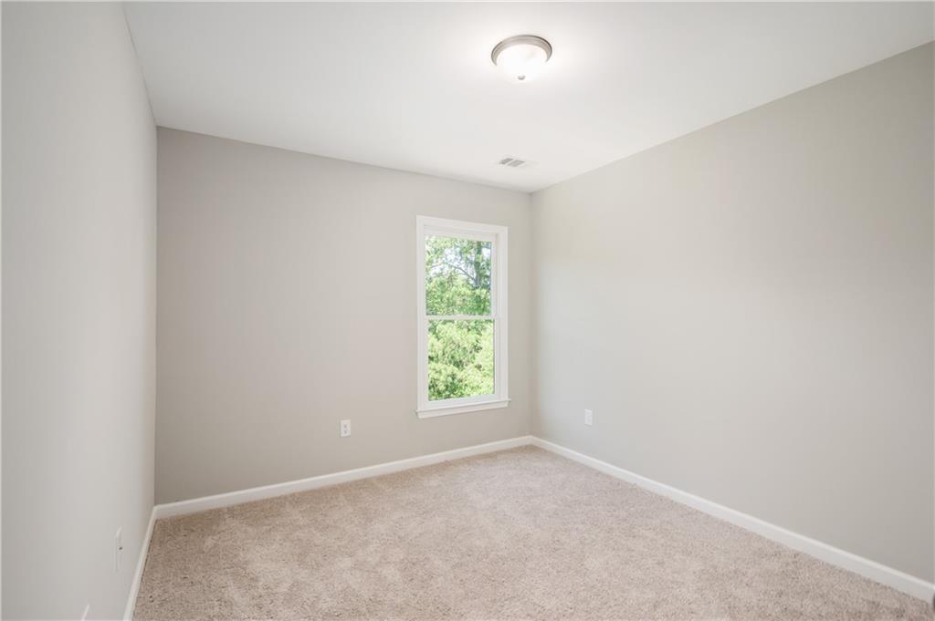 2826 Laurel Ridge Circle East Point, GA 30344 - Photo 18 of 25 an empty room with windows