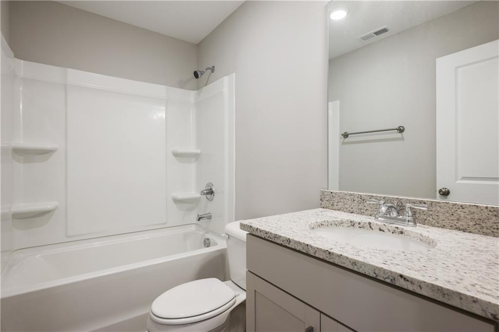 2826 Laurel Ridge Circle East Point, GA 30344 - Photo 20 of 25 a bathroom with a granite countertop sink toilet and shower