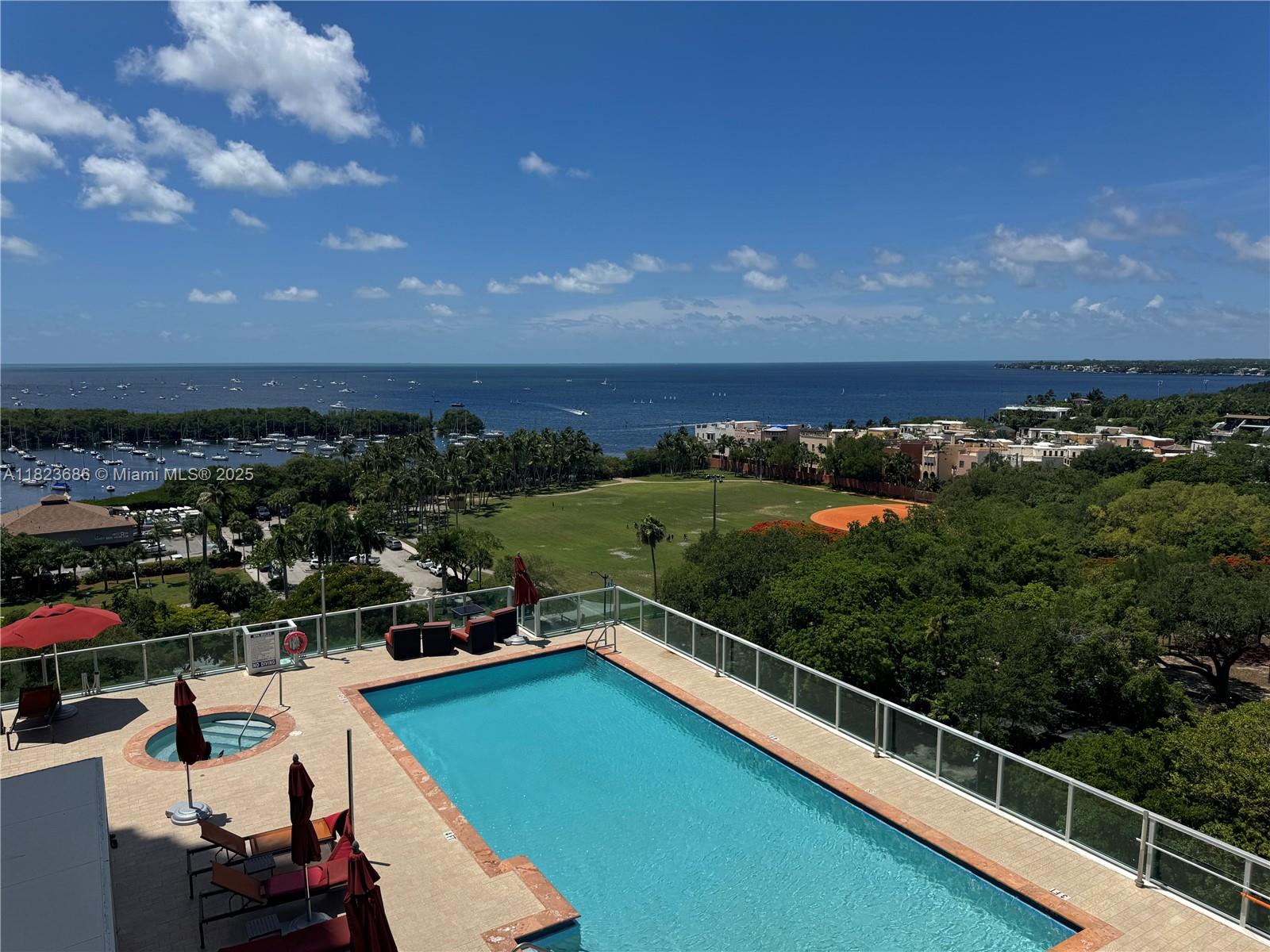 2889 McFarlane Road, Unit 1016 Miami, FL 33133 - Photo 12 of 12 a view of a balcony with chairs