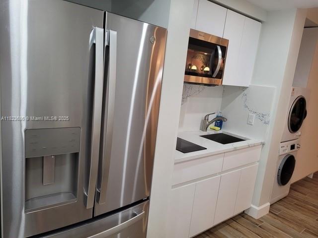 2889 McFarlane Road, Unit 1016 Miami, FL 33133 - Photo 3 of 12 a utility room with dryer and washer