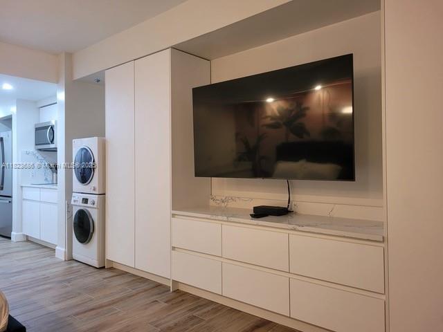2889 McFarlane Road, Unit 1016 Miami, FL 33133 - Photo 7 of 12 a view of livingroom with furniture and flat screen tv