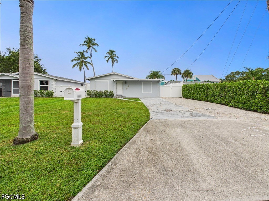 567 13th Street North Naples, FL 34102 - Photo 1 of 23 a view of a garden with a house