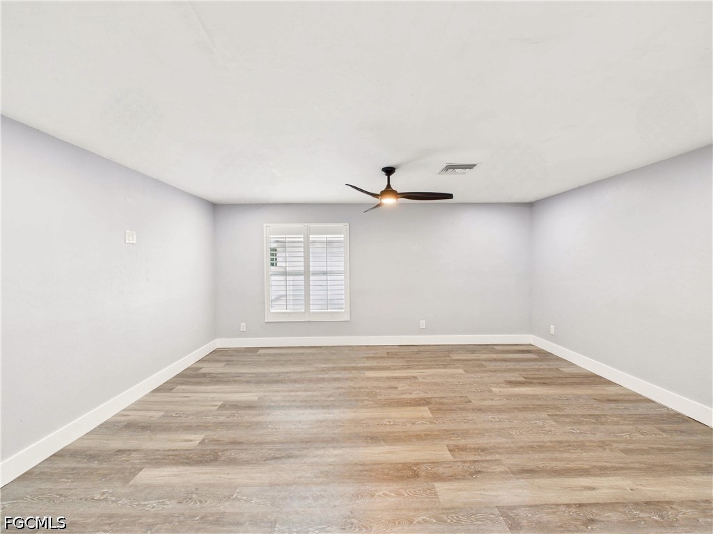567 13th Street North Naples, FL 34102 - Photo 18 of 23 a view of an empty room with a window