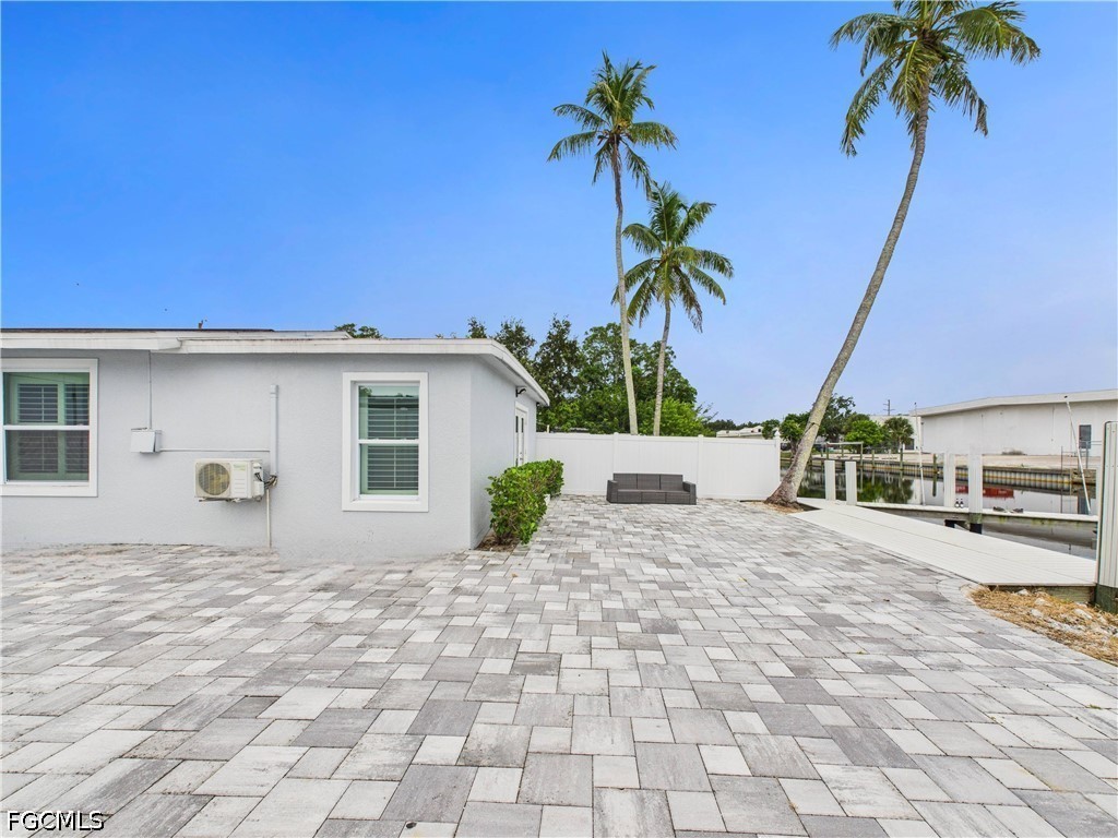 567 13th Street North Naples, FL 34102 - Photo 22 of 23 a view of a house with a patio