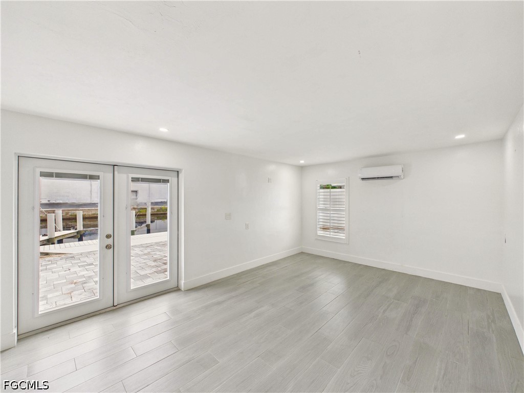 567 13th Street North Naples, FL 34102 - Photo 10 of 23 an empty room with windows