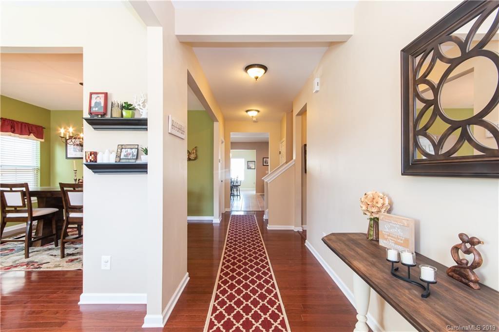 10937 Tailwater Street Davidson, NC 28036 - Photo 2 of 34 a hallway with dining area and livingroom view