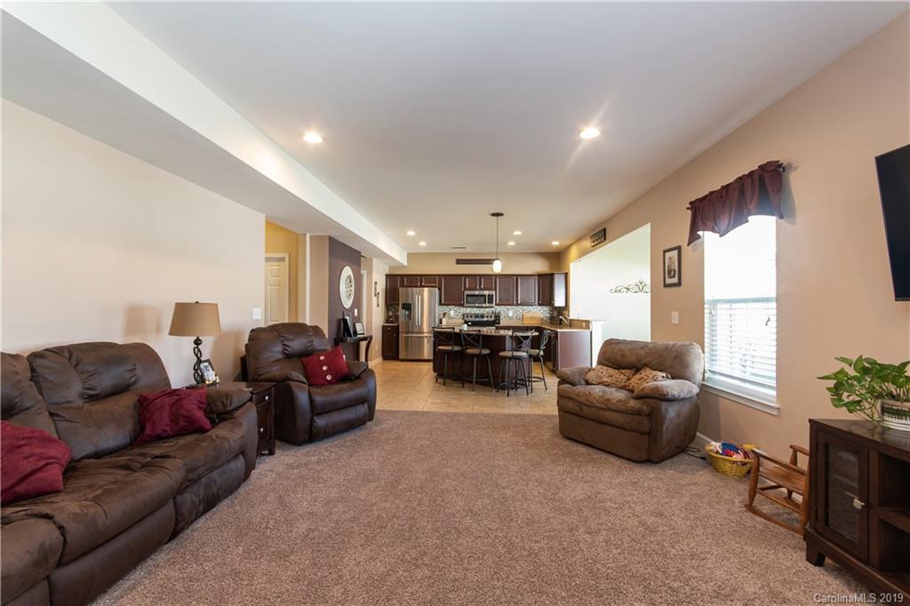 10937 Tailwater Street Davidson, NC 28036 - Photo 13 of 34 a living room with furniture and a large window