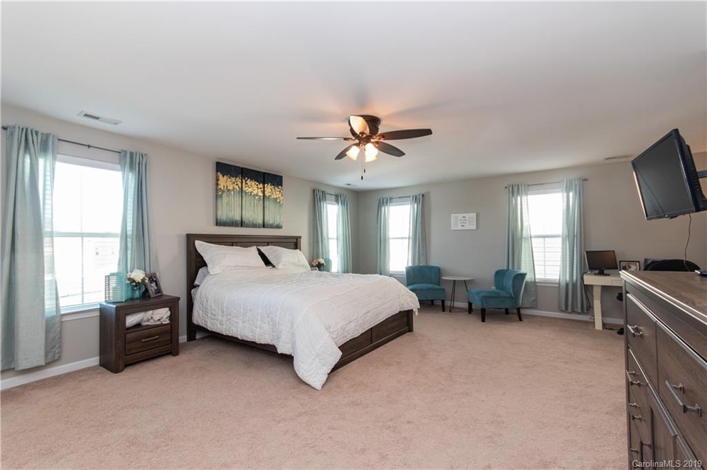 10937 Tailwater Street Davidson, NC 28036 - Photo 14 of 34 a bed room with a bed and a television