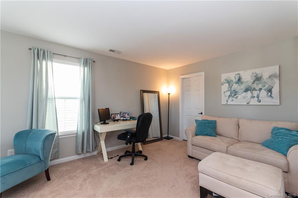10937 Tailwater Street Davidson, NC 28036 - Photo 16 of 34 a living room with furniture and a window