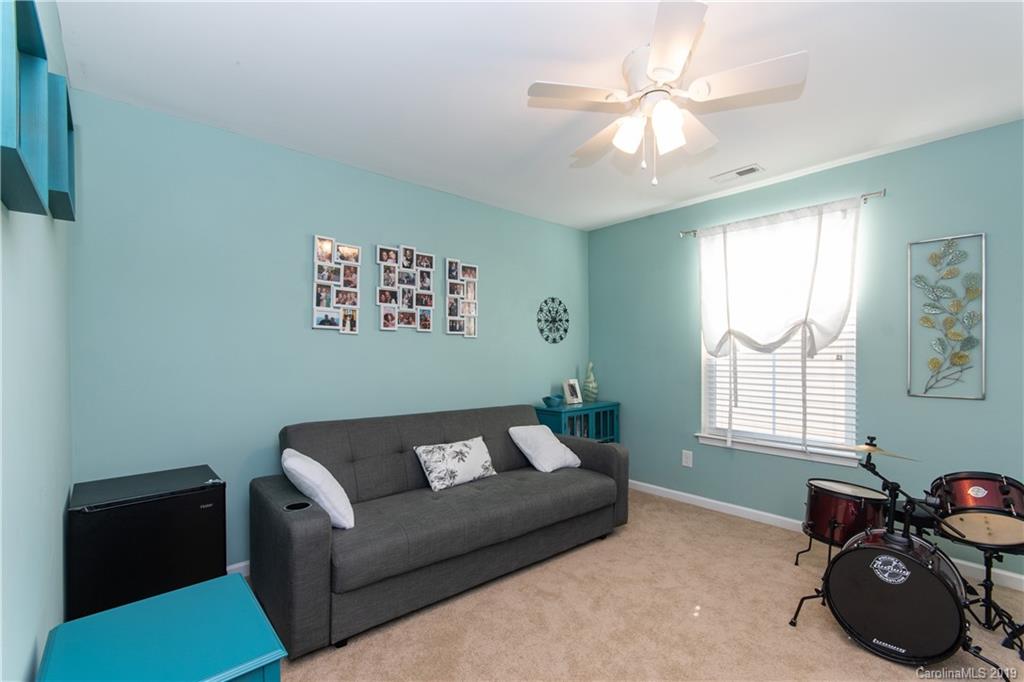 10937 Tailwater Street Davidson, NC 28036 - Photo 19 of 34 a living room with furniture and a window