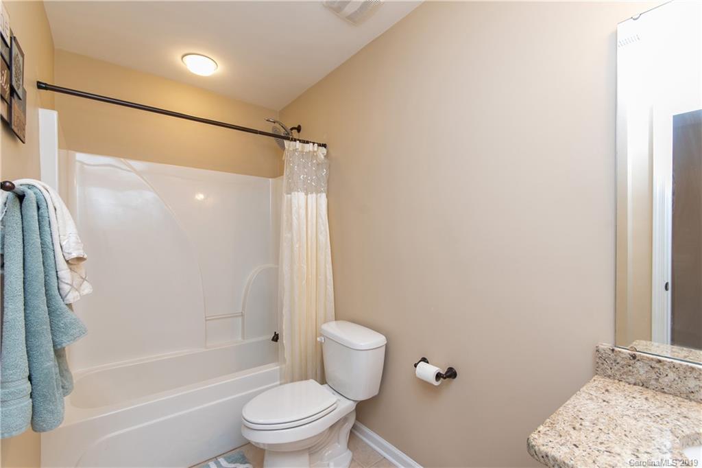 10937 Tailwater Street Davidson, NC 28036 - Photo 21 of 34 a bathroom with a toilet and a shower