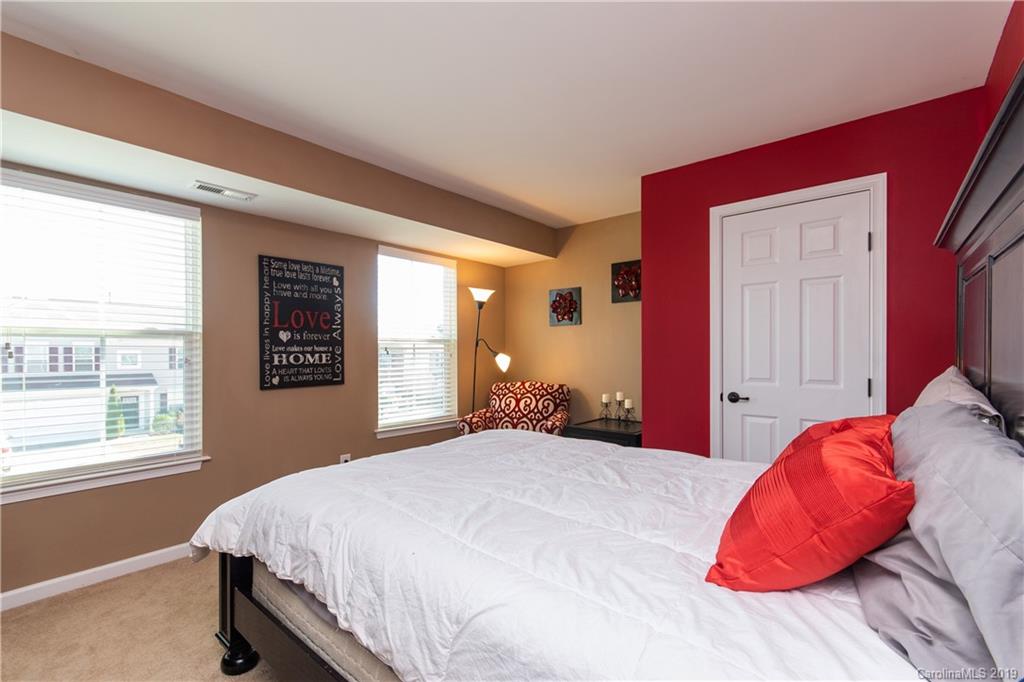 10937 Tailwater Street Davidson, NC 28036 - Photo 22 of 34 a bedroom with a bed and a window