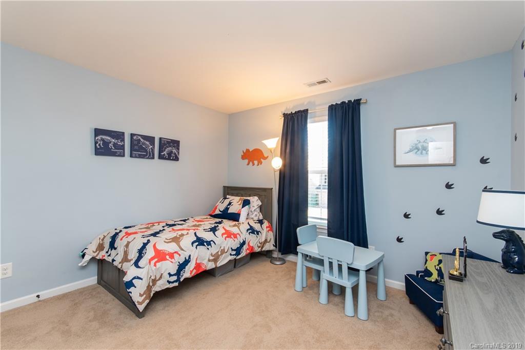 10937 Tailwater Street Davidson, NC 28036 - Photo 23 of 34 a bedroom with a bed and a window