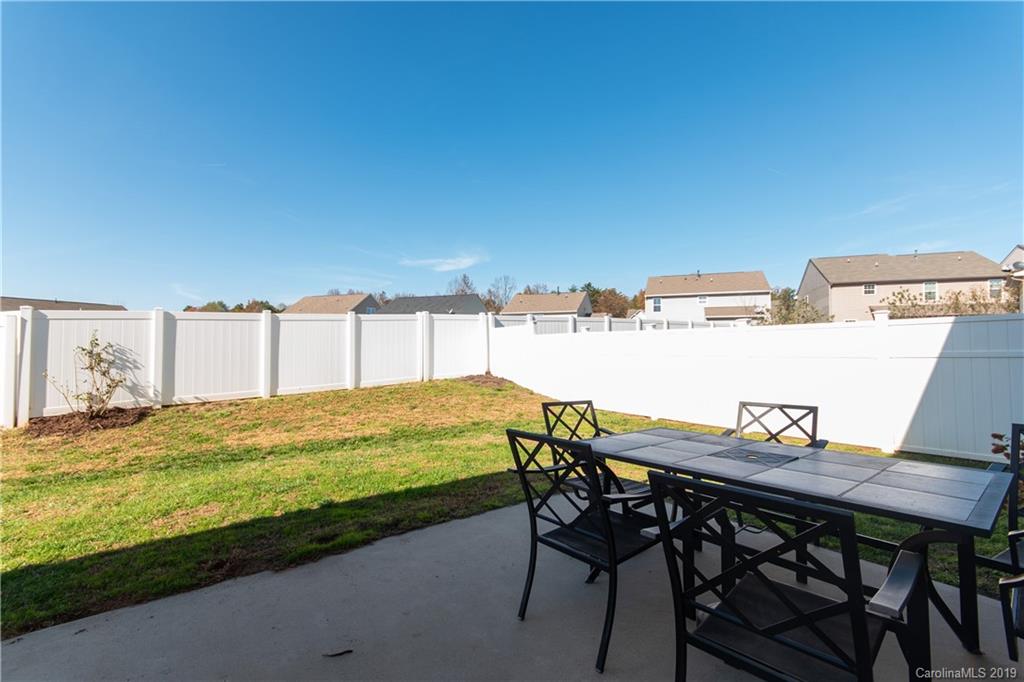10937 Tailwater Street Davidson, NC 28036 - Photo 26 of 34 a view of a chairs and table on the terrace