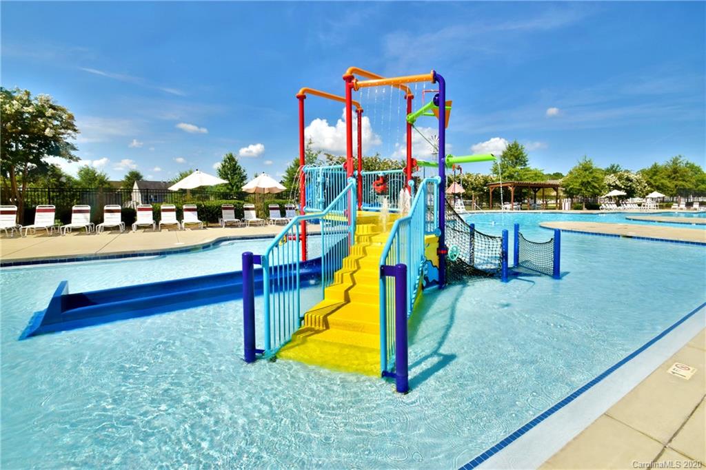 10937 Tailwater Street Davidson, NC 28036 - Photo 30 of 34 a view of a park with swings and slides