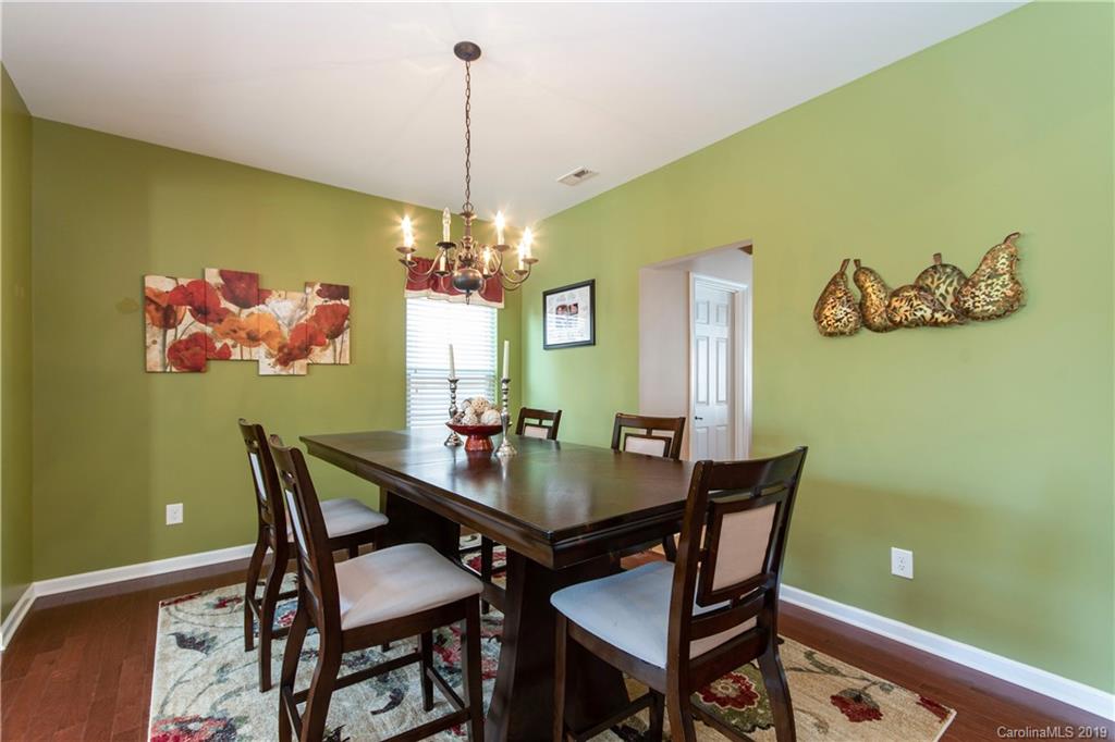 10937 Tailwater Street Davidson, NC 28036 - Photo 4 of 34 a view of a dining room with a table and chairs