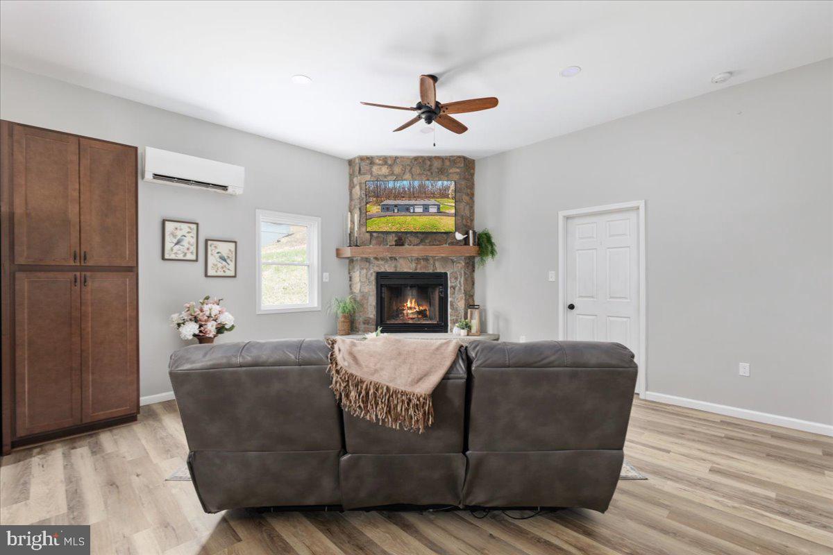 5331 Merry Oaks Road The Plains, VA 20198 - Photo 14 of 54 a living room with furniture a fireplace and a window