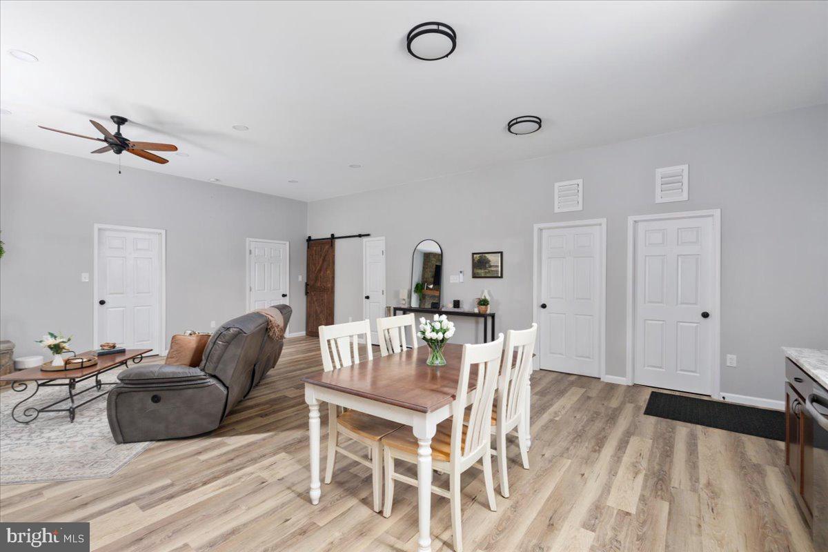 5331 Merry Oaks Road The Plains, VA 20198 - Photo 20 of 54 a living room with furniture a wooden floor and a ceiling fan