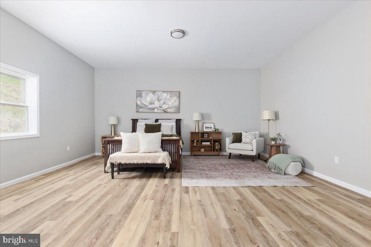 5331 Merry Oaks Road The Plains, VA 20198 - Photo 27 of 54 a bedroom with furniture and a wooden floor