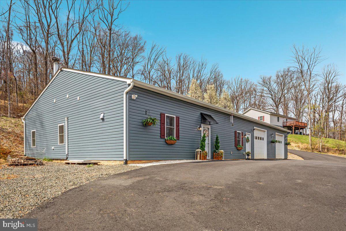 5331 Merry Oaks Road The Plains, VA 20198 - Photo 3 of 54 a view of a house with a yard and garage