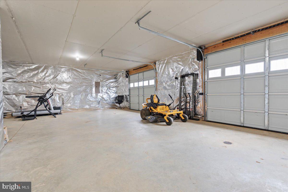 5331 Merry Oaks Road The Plains, VA 20198 - Photo 36 of 54 a view of a garage with furniture and a garage