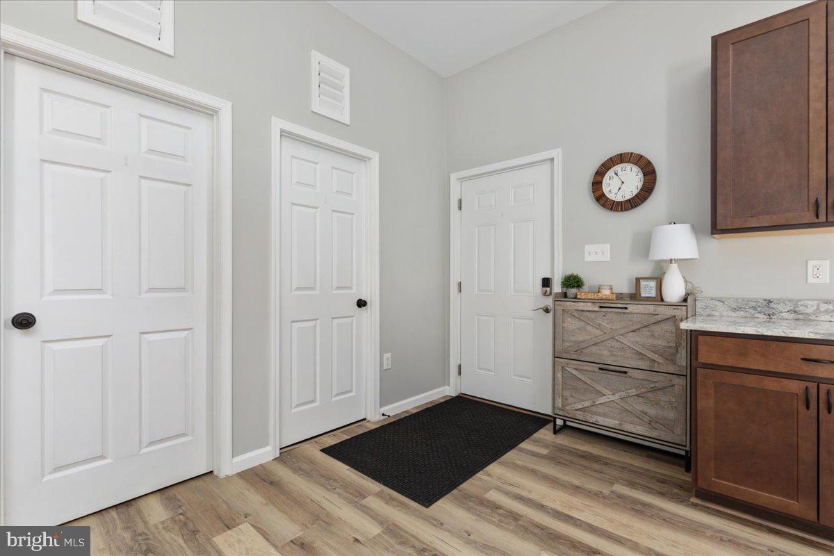 5331 Merry Oaks Road The Plains, VA 20198 - Photo 8 of 54 a room with a dresser and a chandelier
