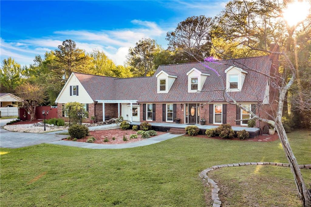 2137 South Van Wert Road Villa Rica, GA 30180 - Photo 1 of 1 a front view of a house with garden