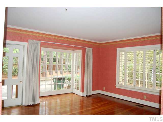 815 Marlowe Road, Unit 1 Raleigh, NC 27609 - Photo 5 of 22 a view of an empty room with wooden floor and a window