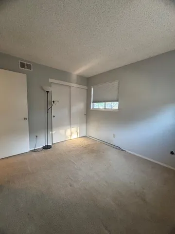 a bathroom with a toilet a sink and shower