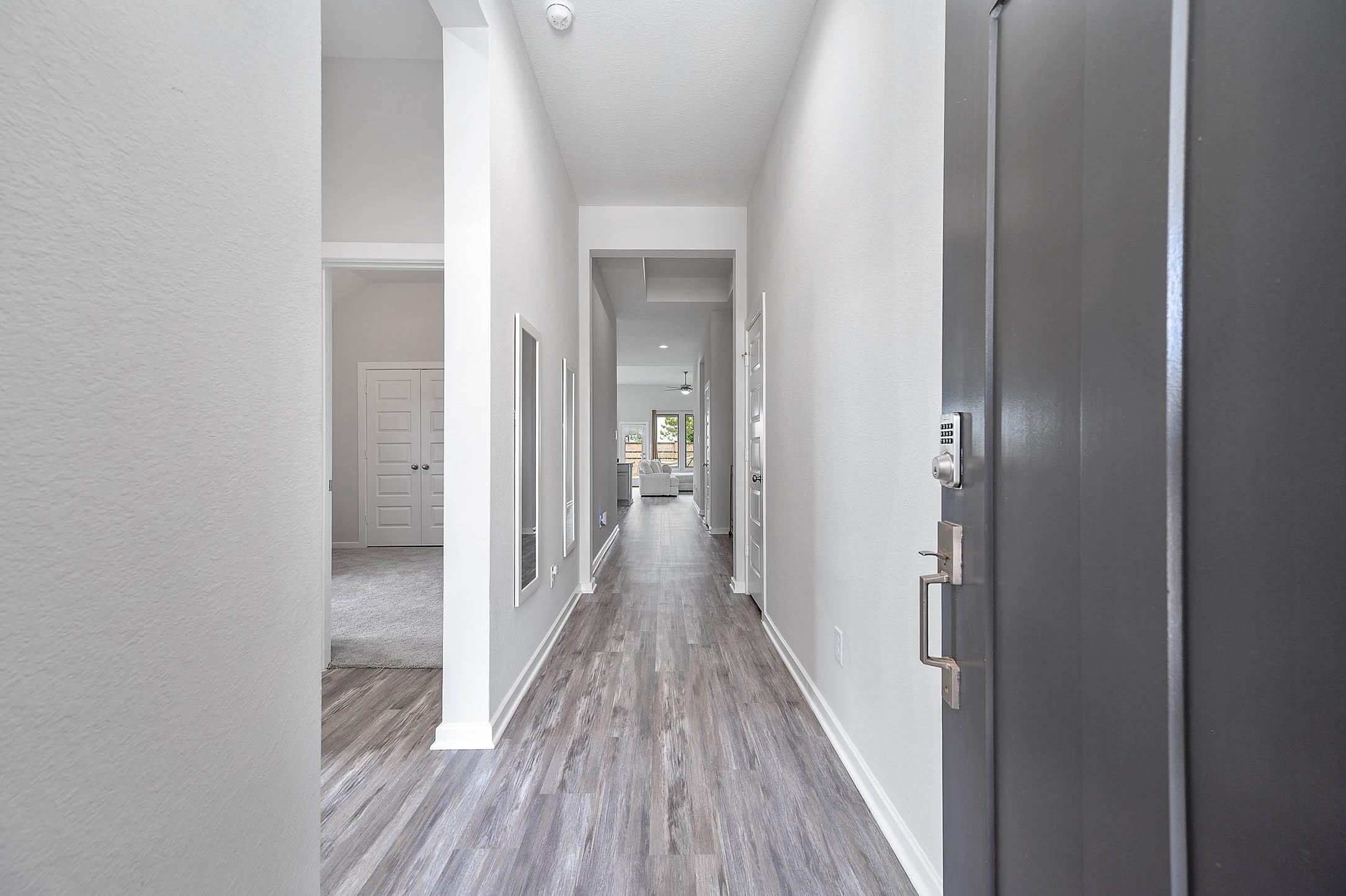 10926 Wander Way Beasley, TX 77417 - Photo 3 of 38 a view of a hallway with wooden floor