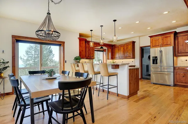 a view of a dining room with furniture window and outside view