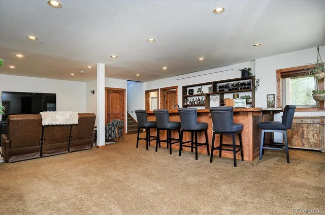 a view of balcony with wooden floor and outdoor seating