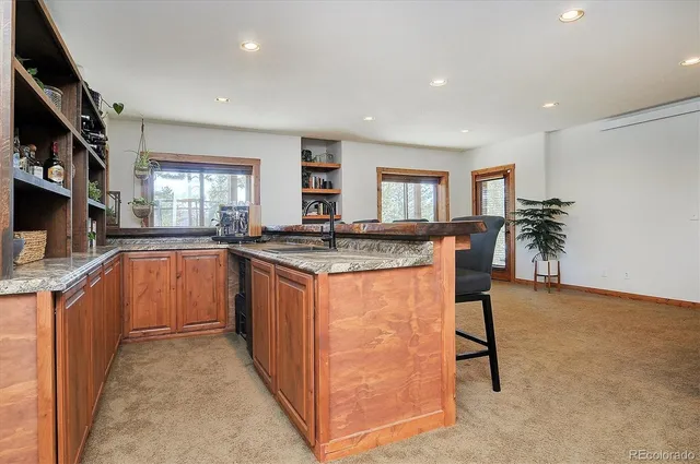 a view of balcony with wooden floor and fence